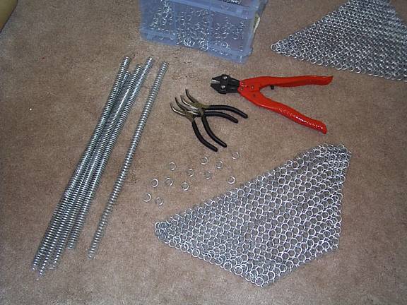 Chainmaille-making supplies. With a simple set ofbolt-cutters and two pairs of bent-nose pliers, you cantake coils of wire (made by coiling down a rod on a power-drill)and cut them into links that can be assembled into maille as shown.