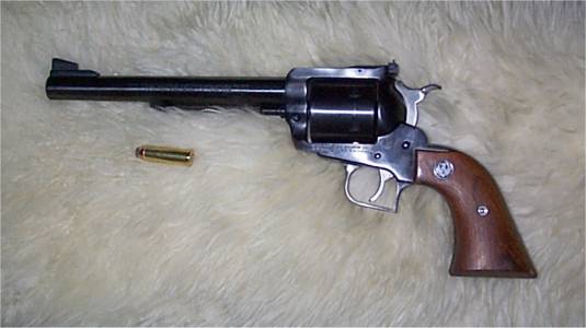 This year, as part of my celebration of finding a new job at a good company,I've treated myself to a few new toys. One of them is this .44 Magnum. Ohmy, this thing can knock you on your ass... It takes a strong arm and a stillmind to keep control this thing. I'm impressed. (<A href="http://ed.toton.org/guncontrol.html">My views on Gun Control</A>)
