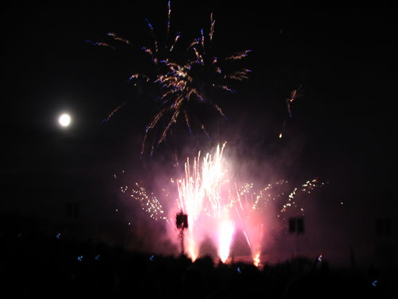 Saturday night's fireworks, with the moon in the background.