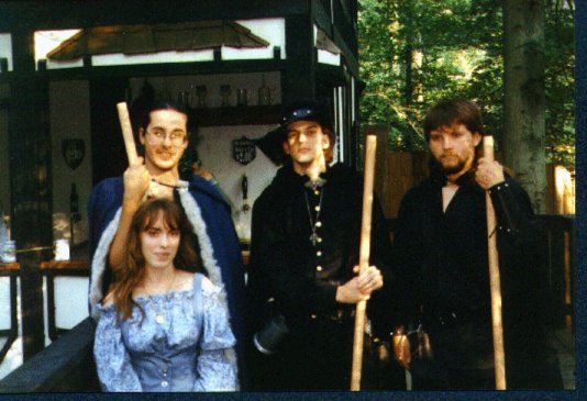 This was one of our annual trips to the RenFest. In the back, respectively are Me, Sir Ace Hunter (aka Derek my former room-mate), and Midnight Wolf (Chuck).In front is Furball (aka Stacy).[not the greatest scan, but hey...] :-)