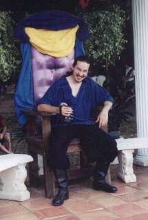 I look good on the throne, don't I? :) This was taken at The Maryland Renaissance Festival(MDRF). 'Tis the King's seat, but everyone uses it as a picture-taking spot, so methinksthe King doesn't mind. Unfortunately I'm running a bit low on pictures for the 1999 fallseason at MDRF even though I've been going every weekend, since I've been focusing more on having fun and less on getting pictures.