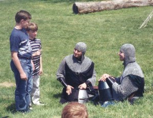While at the VA RenFest, we got approched by some kids who wanted to interview someonefor a school project they were doing on medieval weaponry. Who else but some armoredknights could answer such questions? :)