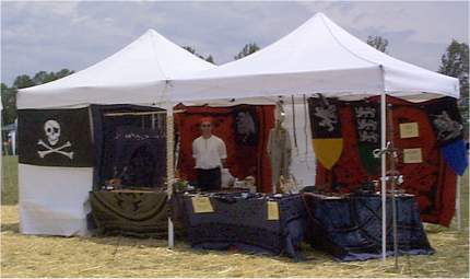 My booth at the Virginia Renaissance Festival. Inside you can see Dave,my booth-partner. He was selling jewelry, and I was of course<A href="http://www.necrobones.com/armory/">selling swords and weapons</A>.