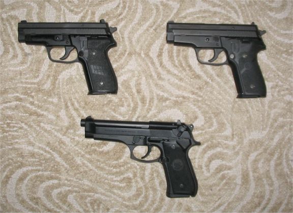 Here's my semi-autos. From left to right at the top are mySig 229 9mm, and my Sig 229 .40 cal. On the bottom is theBeretta 92FS 9mm.