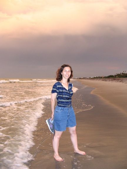 My dearest, standing on the beach.