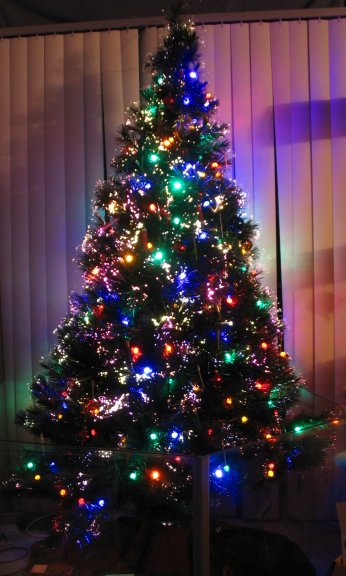 This year's Christmas tree! Lots of fiber optics, LED light strings, shotgun shells, and sword toothpicks. The Star Trek ships are gettingthe year off.