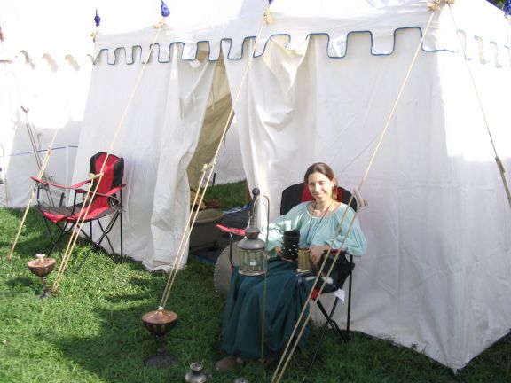  My lovely dearest Kat, sitting in front of the tent after setting it upat Pennsic 35. We had a wonderful time! We have <A href="/photos/2006/pennsic/">many pictures</A>.