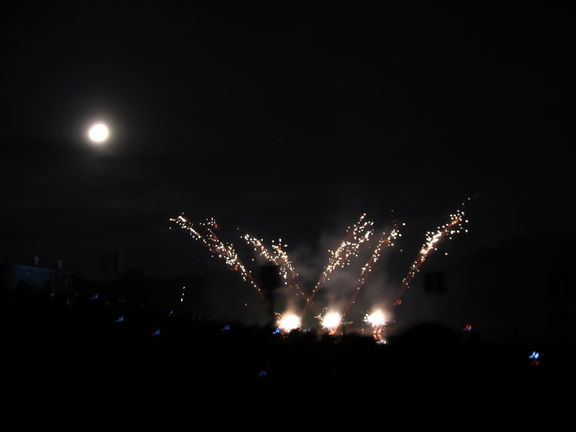 Saturday night's fireworks, with the moon in the background.