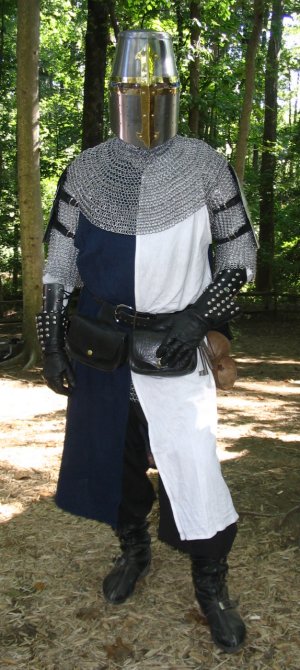 And the results of the sewing... A nice new surcoat! Alongwith my new helmet, I was looking pretty slick, and gettingstopped for pictures and questions and admiration all day.I never get this much attention, even in my plate armor.