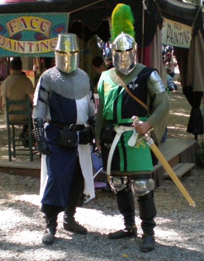 It's always nice to find a fellow knight and enthusiastat the faire. It doesn't happen often enough, I must say.You see a lot of people with individual armor elements, or highly fantasy-like armor, or highly mismatched armor. Butwhen people go the extra mile to have a helmet and surcoat,it's quite cool. I don't always bring my helm, but afterthe success I had with the new one this day, I shall doso much more frequently now.