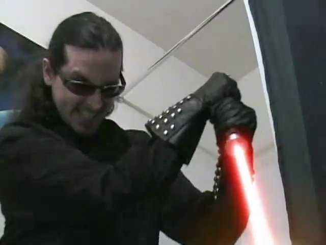 Me stabbing the toilet with a lightsaber. Actually, it's a frame from one of my comedy <A href="//lightsabers.necrobones.com/">lightsaber videos</A>.