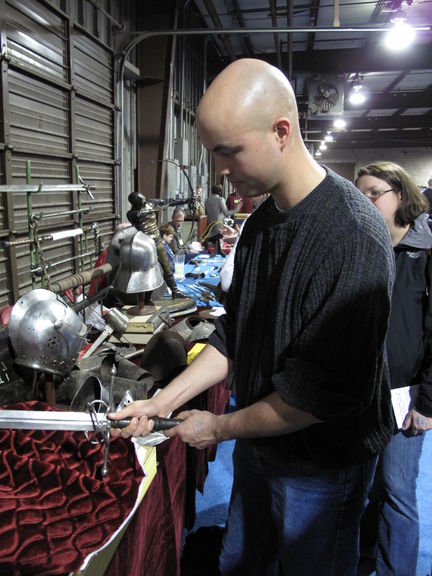 Bill examining an antique longsword. This one was about $8,000.