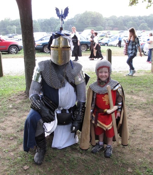 MDRF. A very young knight wanted his picture taken with me. Even kneeling, I'm much bigger, but he was not shy. He wore realmail! I loved it!