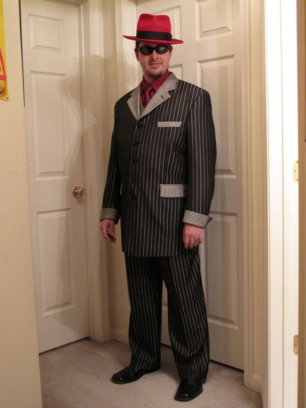 I finally got a fantastic 3-piece suit! It's not actually a "zoot suit"since it doesn't have the baggy pants with tight cuffs, padded shoulders, and triangle-frameto the jacket shape.