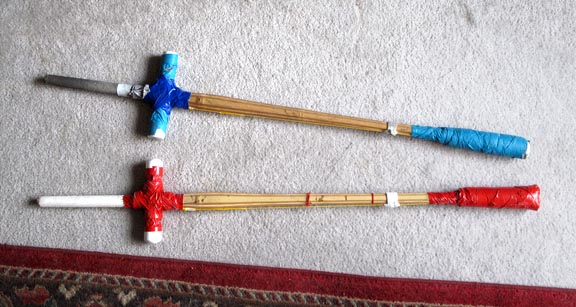 Very inexpensive practice swords, made from shinai by adding PVC pipe parts for a crossguard,and some foam rolled up into a thrusting tip. They're cheap, they're ugly, but they're fairly safe to work with and make a great inexpensive way for newbies to get started.